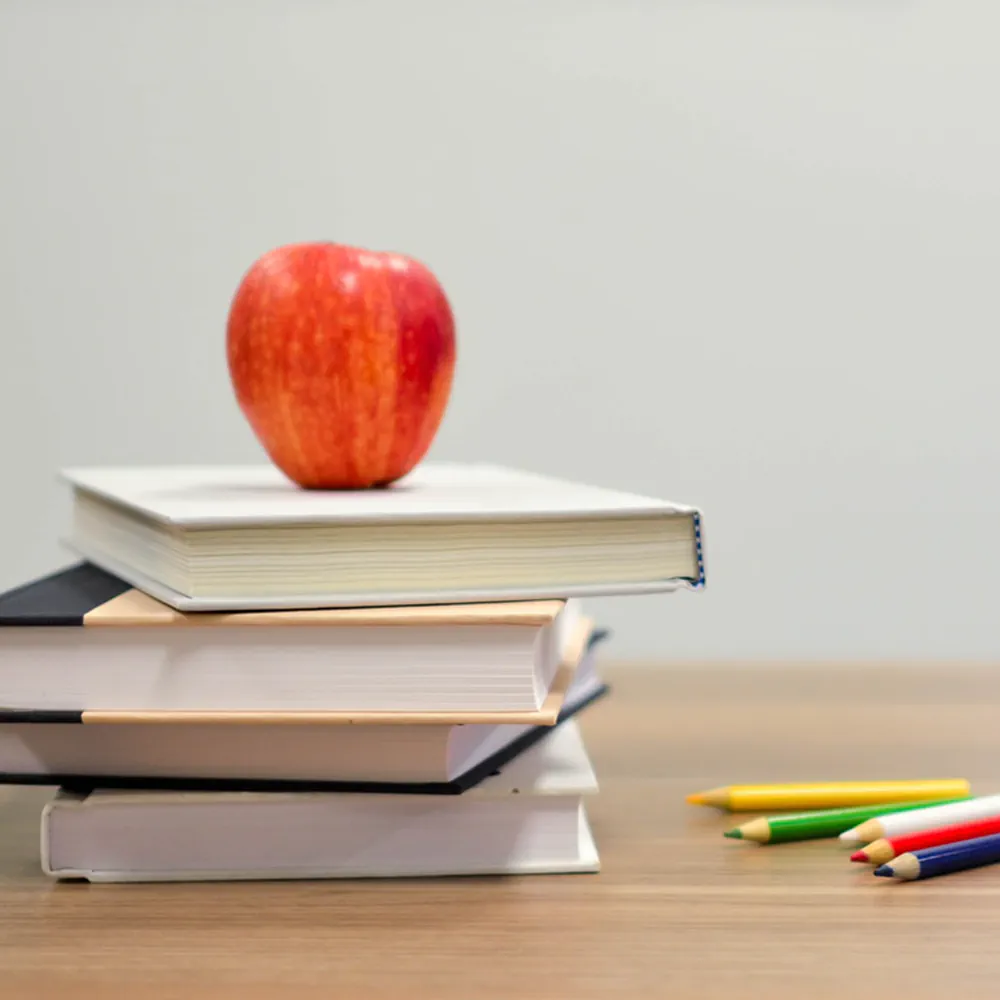 Books and apple